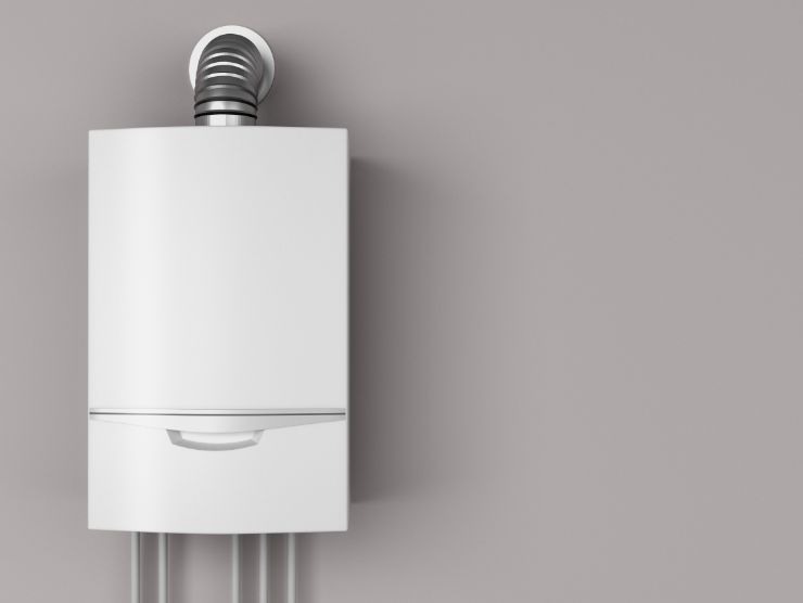 caldaia su una parete grigia