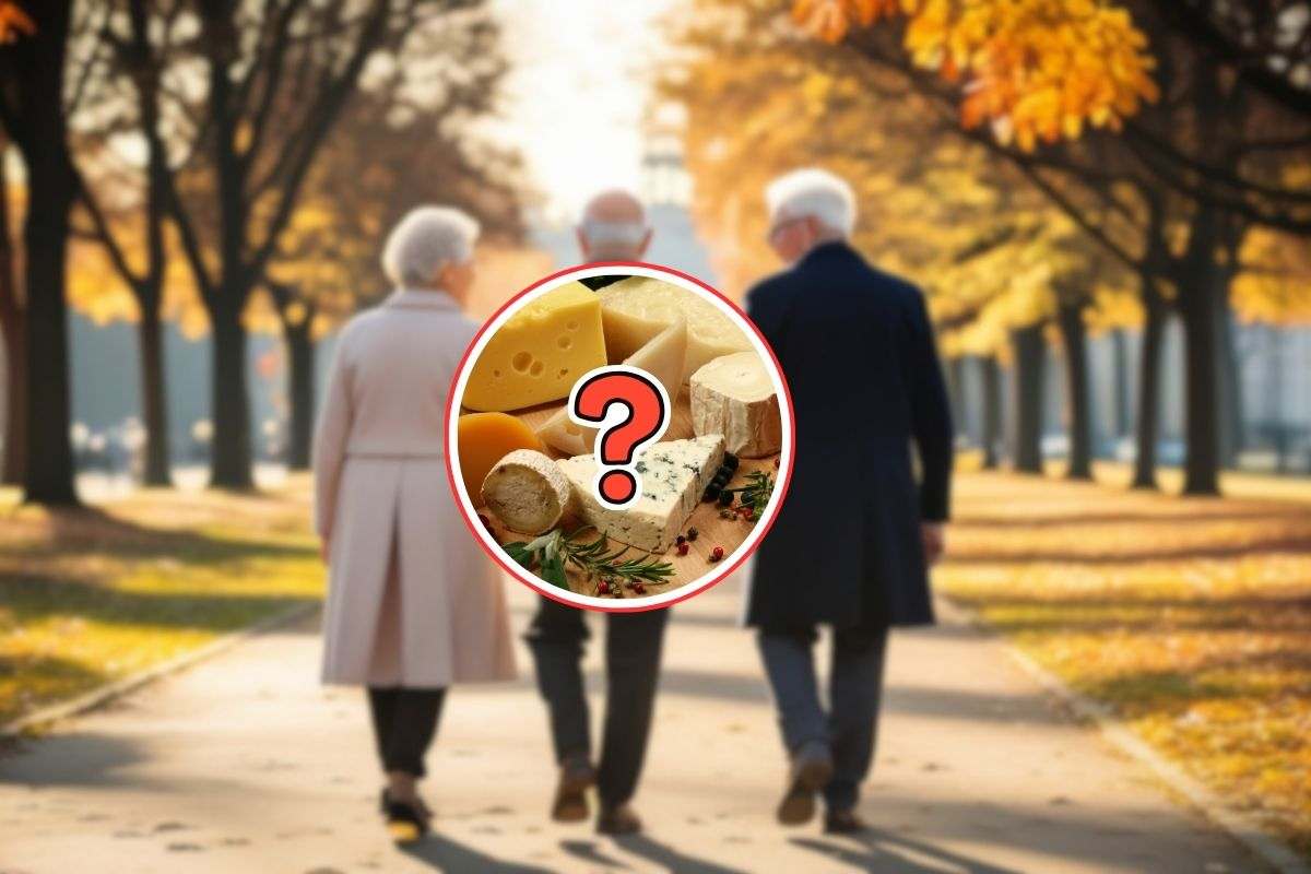 3 persone anziane che camminano in un parco in autunno e in primo piano una selezione di formaggi