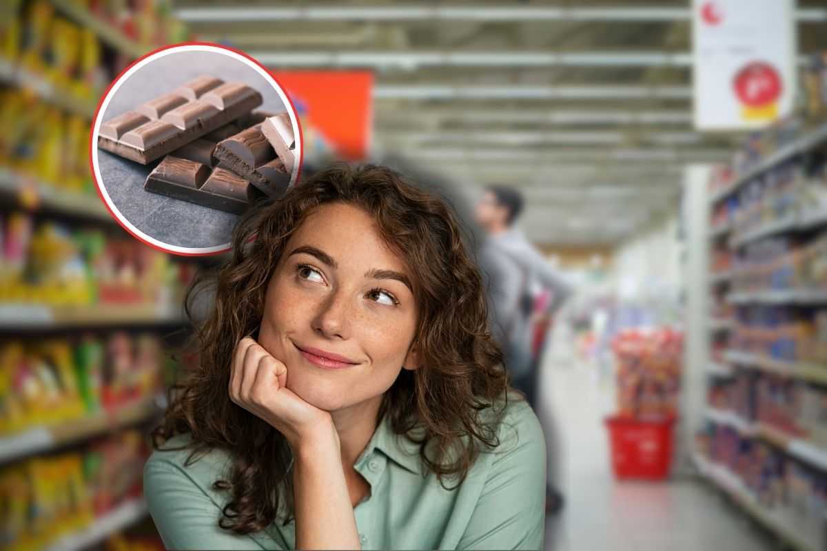 donna tra le corsie del supermercato, cioccolato in icona rossa e donna che pensa